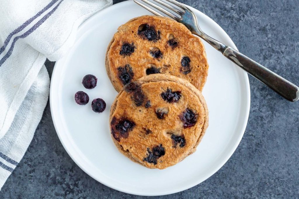Blueberry Almond Pancakes on a white plate.