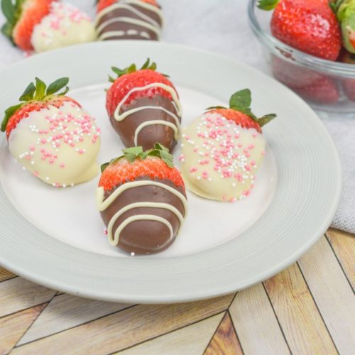 Diabetic-Friendly Chocolate Covered Strawberries Chocolate covered strawberries on a white plate.