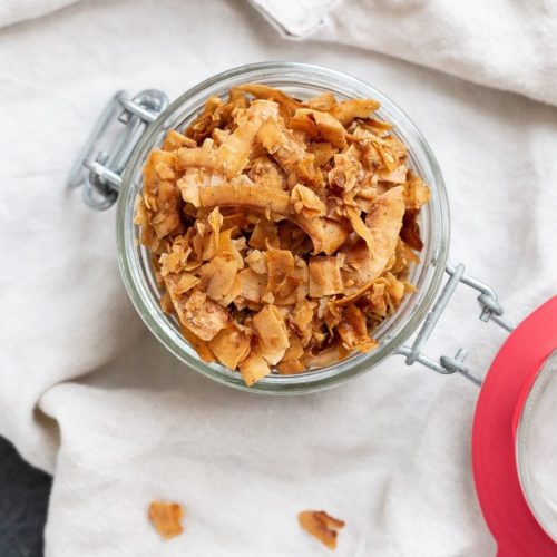Diabetic-Friendly Cinnamon Coconut Chips Cinnamon coconut chips in a mason jar.