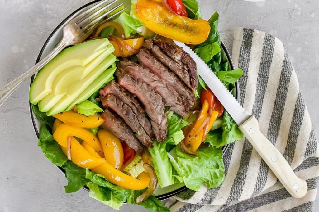 Steak Fajita Salad with a knife.