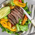 Steak Fajita Salad with a knife.