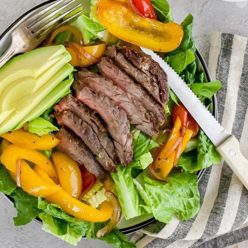 Diabetic-Friendly Steak Fajita Salad Steak Fajita Salad with a knife.